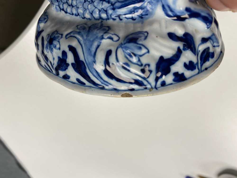 A Dutch Delft blue and white butter tub in the shape of a mermaid, 18th C.